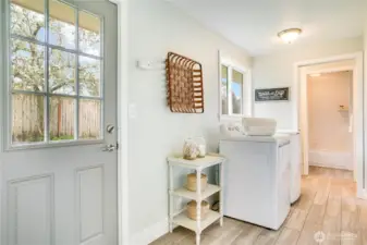 We walked through the kitchen and are in the west wing of the home. Laundry room and full bathroom are found here as well as access to the bonus room above the garage.