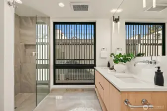 Primary bathroom with curbless shower and floating double vanity