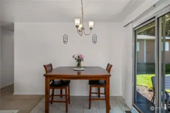 Dining area off of kitchen, convenient to the sunny back patio.