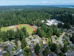 Ariel view shows that this homes backs up the the Fairview ball field.