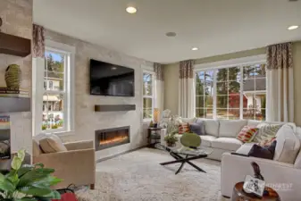 Tall oversized windows throughout the main floor allow for an abundance of natural light! Tall windows in the family room allow for an abundance of natural light. Photo for illustration purposes only & not of actual home available for sale. The Elm design by Toll Brothers built in a previous community.