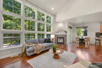 It's just stunning!!! A wall of windows backing to woods and a gorgeous landscape behind the home - all part of your .56 acre lot.