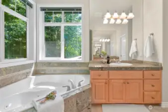 Jetted tub and second vanity to luxuriate in every day.