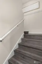 A staircase that does more than connect floors—it elevates your lifestyle with warm-toned wood and a modern, minimalist railing.