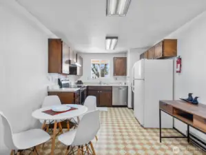 Kitchen has lots of room- open wall to living area?