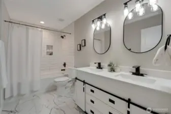 A full bath with a double vanity, providing plenty of space for busy mornings.