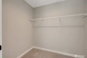 A walk-in closet with plenty of space, perfect for keeping your wardrobe organized and accessible.