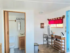 1/2 bath + it's plumbed for W/D or add a little kitchen.
