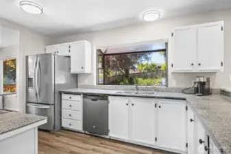 Large window behind the sink giving you a perfect view of the backyard.