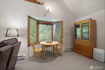 Be with nature as you use this convenient eating nook with triptych window.