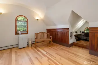 Carpenter Gothic style is found in the pointed vault leading to the gabled office.