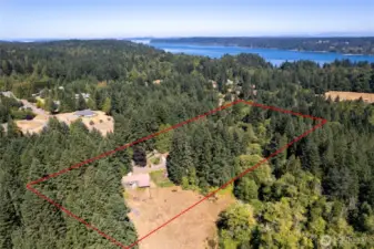 4.44 acres complete with rolling fields, wooded timber, and the Fragalia-Phinney creek running through!