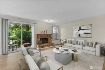 Living room with wood burning fireplace. Virtually staged