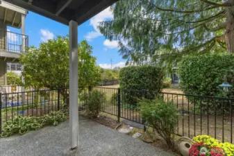 The Lg fenced in patio area. The gate leads you out to the grounds & the pool is also in this building.