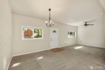 Kitchen view into dining and living rooms