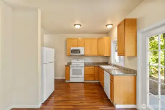 Bright kitchen space with all appliances.