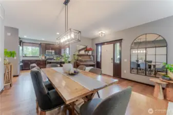 Gracious dining area opens to a well-appointed kitchen with casual eating space, perfect for hosting, meal prep, or homework central