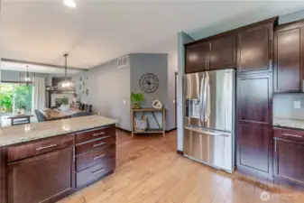 Open-concept flow from kitchen to dining and living areas creates a seamless space for connection, entertaining, and everyday ease.  All appliances stay