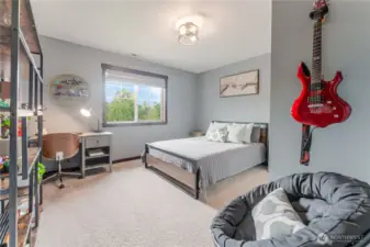 Bedroom #1 features generous natural light, soft neutral tones, and a spacious closet