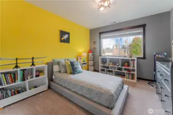 Bedroom #3 features cheerful design elements and tons of space for storage