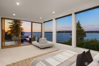 View from the primary bedroom. The primary bedroom features new carpet, an oversized 5-bath suite, french doors, custom walk-in-closet and a slider out to the expansive deck.