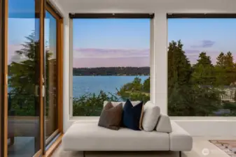 View from the primary bedroom with sliders out to the deck.