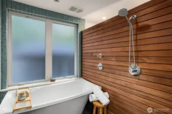 Soaking tub fills from the ceiling spout.