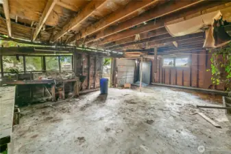 600 sqft detached garage. Concrete slab is good, but needs a whole new structure.