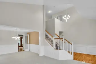 Entry leads to the living and dining rooms. Notice the architectural wainscoting!