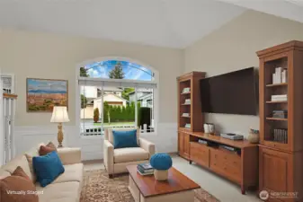 Virtually staged vaulted living room.