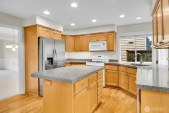 Lots of great storage in this kitchen with gas range and newer SS refrigerator.