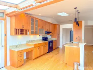 Very attractive and functional kitchen with gorgeous granite countertops and custom cabinetry.