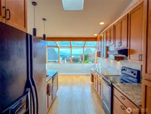 On a less cloudy day, the snow-capped majestic Mount Baker is visible through the sunroom windows.