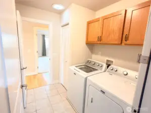 Primary bedroom appropriately located across the hall from laundry room.