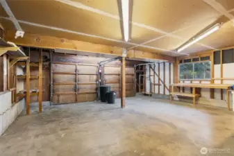 Oversized garage with work benches