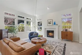 View of your formal living room at entry, I really love the vaulted ceilings and wall of windows that let in all the light. Your formal dining room is to your right.