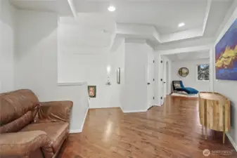 Upstairs landing shot, Sellers used it as a gaming center for their kids, primary suite straight ahead and note the beautiful ceilings and floors!