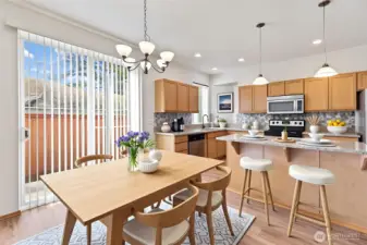Virtually staged Dining area, kitchen, Center island with bar. Sliders lead to backyard