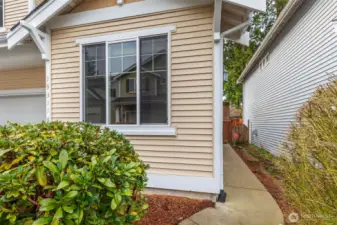 walkway to the front door.  Window is to the main floor office