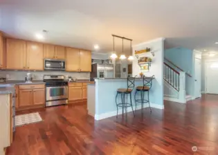 Open eat in kitchen with expansive countertops.