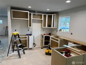 Kitchen, cabinets will be white.