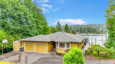 Oversized driveway for lots of parking or storing RV & trailers. Separate storage shed and tons of yard for cornhole, volleyball, badminton or all three!