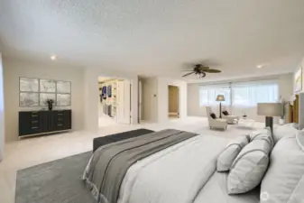 The immense Primary Suite has an ensuite bath, fireplace, double-door entry and new carpet.