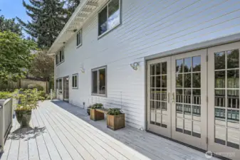 The Trex deck runs the entire length of the home and features new Marvin doors that provide access to the dining and family rooms.