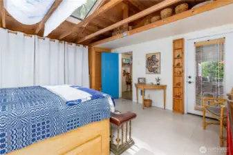 Primary bedroom with door to the deck. Lots of storage here