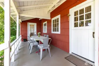 Deck overlooking the water and spacious meadow