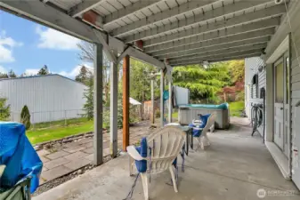 Covered patio off the lower level family room.