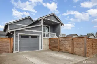 Home includes an extra wide driveway with second parking space and a fully fenced yard with 4 locking gates.