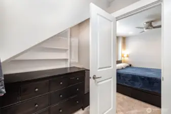 Spacious walk-in closet doubles as a tech hub, featuring a Smart Panel with Ethernet and PoE switch boards, plus a Smurf tube running to the attic—perfect for future wiring upgrades.