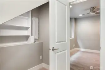 The closet doubles as a tech hub, featuring a Smart Panel with Ethernet and PoE switch boards, plus a Smurf tube running to the attic—perfect for future wiring upgrades.